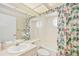 Charming bathroom with floral shower curtain at 4995 Pepperwood Pl, Venice, FL 34293