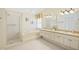 Elegant bathroom with double vanity and soaking tub at 4995 Pepperwood Pl, Venice, FL 34293
