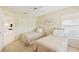Bright bedroom with two twin beds and window at 4995 Pepperwood Pl, Venice, FL 34293
