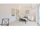 Sunroom with built-in shelving and comfortable seating area at 4995 Pepperwood Pl, Venice, FL 34293