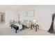 Living area with neutral-toned furniture and a cozy atmosphere at 4995 Pepperwood Pl, Venice, FL 34293