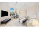 Combined living and dining room with a chandelier and large windows at 4995 Pepperwood Pl, Venice, FL 34293