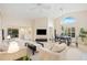 Open-concept living and dining area with vaulted ceilings at 4995 Pepperwood Pl, Venice, FL 34293