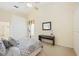Bright bedroom with a view and neutral decor at 4995 Pepperwood Pl, Venice, FL 34293