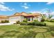 Attractive single-story home with well-manicured lawn and attached garage at 4995 Pepperwood Pl, Venice, FL 34293