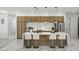 Modern kitchen with wood cabinets, white countertops, and island with seating at 45 Bunker Ln, Rotonda West, FL 33947