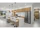 Open concept kitchen with stainless steel appliances and white marble countertops at 45 Bunker Ln, Rotonda West, FL 33947