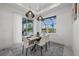 Bright dining room with a table for six and pool views at 45 Bunker Ln, Rotonda West, FL 33947