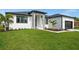 Single-story home with a two-car garage and attractive landscaping at 45 Bunker Ln, Rotonda West, FL 33947