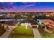Stunning aerial view of a canal-front home at dusk at 45 Bunker Ln, Rotonda West, FL 33947