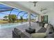 Covered patio with pool, seating area, and view of the canal at 45 Bunker Ln, Rotonda West, FL 33947
