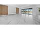 Open concept living room with marble floors and view of the pool at 45 Bunker Ln, Rotonda West, FL 33947
