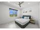 Guest bedroom with a queen bed and access to a bathroom at 45 Bunker Ln, Rotonda West, FL 33947