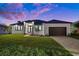 Single story home with modern design and two car garage at 45 Bunker Ln, Rotonda West, FL 33947