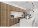 Modern kitchen with wood cabinets, white countertops and stainless steel appliances at 45 Bunker Ln, Rotonda West, FL 33947