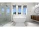 Luxurious bathroom with a freestanding tub and walk-in shower at 45 Bunker Ln, Rotonda West, FL 33947