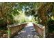 Scenic wooden bridge surrounded by lush greenery at 12271 Lavender Loop, Bradenton, FL 34212
