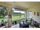 Relaxing screened porch overlooking a pond and lush greenery at 12271 Lavender Loop, Bradenton, FL 34212