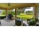 Relaxing screened porch overlooking a pond and lush greenery at 12271 Lavender Loop, Bradenton, FL 34212