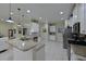 Spacious kitchen with granite counters, stainless steel appliances, and white cabinets at 12271 Lavender Loop, Bradenton, FL 34212