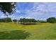 Serene pond view with lush landscaping and beautiful trees at 12271 Lavender Loop, Bradenton, FL 34212