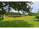 Peaceful pond view from backyard with lush landscaping at 12271 Lavender Loop, Bradenton, FL 34212