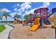 Modern playground by the lake with slides and play area at 12271 Lavender Loop, Bradenton, FL 34212