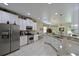 Large kitchen with granite countertops, stainless steel appliances, and ample cabinet space at 12271 Lavender Loop, Bradenton, FL 34212