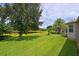 Spacious backyard with pond views and lush landscaping at 12271 Lavender Loop, Bradenton, FL 34212
