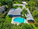 Aerial view of a single-story home with a kidney-shaped pool and lush landscaping at 1389 Harbor Dr, Sarasota, FL 34239