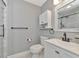 Modern bathroom with white vanity, hex tile floor, and walk-in shower at 1389 Harbor Dr, Sarasota, FL 34239