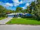 Single story home with a two-car garage and a well-manicured lawn at 1389 Harbor Dr, Sarasota, FL 34239