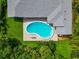 Relaxing kidney-shaped pool nestled in a lush tropical backyard setting at 1389 Harbor Dr, Sarasota, FL 34239