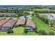Aerial view of the community with well-manicured lawns, lush landscaping, and a refreshing screened pool at 4507 Terrazza Ct, Bradenton, FL 34211