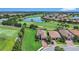 Stunning aerial view of a home with golf course frontage and a scenic water view at 4507 Terrazza Ct, Bradenton, FL 34211