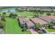 Beautiful aerial view of home next to the golf course with lush greenery and scenic water views at 4507 Terrazza Ct, Bradenton, FL 34211