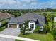 Aerial view of a single Gathering home on a large lot with lush landscaping and golf course views at 4629 Antrim Dr, Sarasota, FL 34240