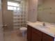 Bathroom with a glass block shower and a vanity with sink at 4973 Village Gardens Dr # 50, Sarasota, FL 34234