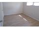 Well-lit bedroom featuring wood-look flooring and neutral paint at 4973 Village Gardens Dr # 50, Sarasota, FL 34234
