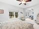 Main bedroom with sitting area and large windows overlooking a lake at 8364 Miramar Way, Lakewood Ranch, FL 34202