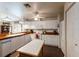 Kitchen with white cabinets and butcher block top at 2407 Waterford Ct, Palmetto, FL 34221