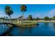 Scenic gazebo near water with bridge and palm trees at 2407 Waterford Ct, Palmetto, FL 34221