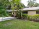 House exterior showcasing carport and landscaping at 4973 Village Gardens Dr # 50, Sarasota, FL 34234