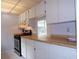 Efficient kitchen with wood countertops and stainless steel appliances at 4973 Village Gardens Dr # 50, Sarasota, FL 34234
