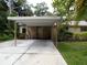 Front view of house with carport and landscaping at 4973 Village Gardens Dr # 50, Sarasota, FL 34234