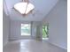 Bright dining room with high ceiling and ceiling fan at 4973 Village Gardens Dr # 50, Sarasota, FL 34234
