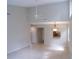 Open living room featuring high ceilings and a ceiling fan at 4973 Village Gardens Dr # 50, Sarasota, FL 34234