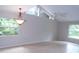 Spacious dining room with large windows and chandelier at 4973 Village Gardens Dr # 50, Sarasota, FL 34234