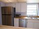 Kitchen features stainless steel appliances and wood countertops at 4973 Village Gardens Dr # 50, Sarasota, FL 34234