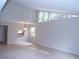 Spacious dining area with tile floors and a view to kitchen at 4973 Village Gardens Dr # 50, Sarasota, FL 34234